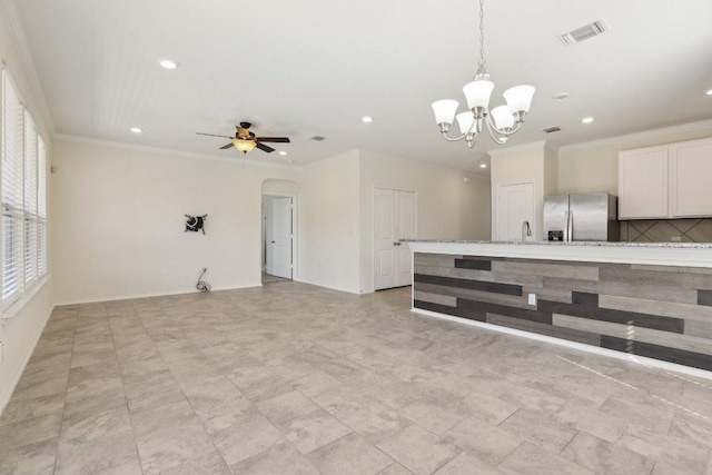 212 Mauldin St, Georgetown, TX 78628 - kitchen featuring stainless steel fridge, recessed lighting, a chandelier, crown molding, and decorative light fixtures