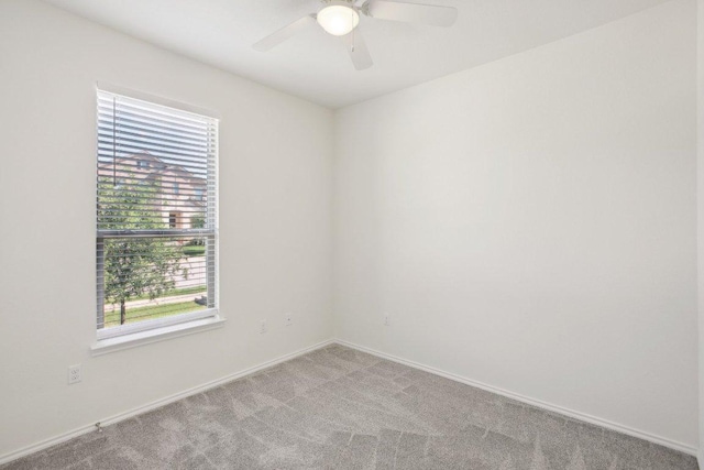 212 Mauldin St, Georgetown, TX 78628 - carpeted spare room featuring a ceiling fan and baseboards