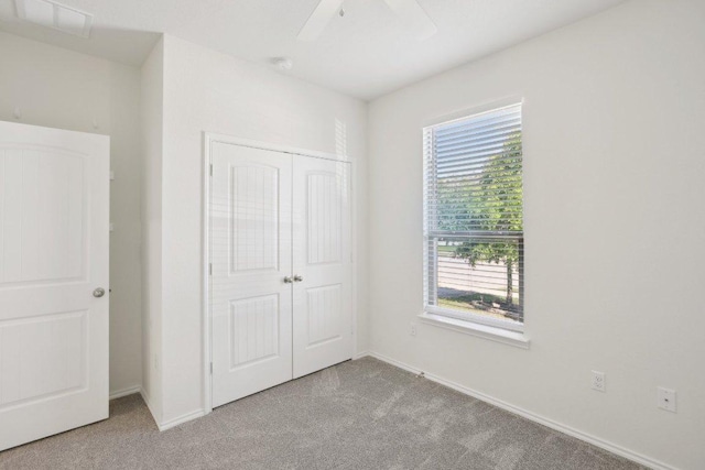 212 Mauldin St, Georgetown, TX 78628 - unfurnished bedroom with carpet floors, a closet, baseboards, and ceiling fan
