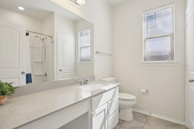212 Mauldin St, Georgetown, TX 78628 - full bathroom with baseboards, vanity, toilet, tile patterned flooring, and a shower