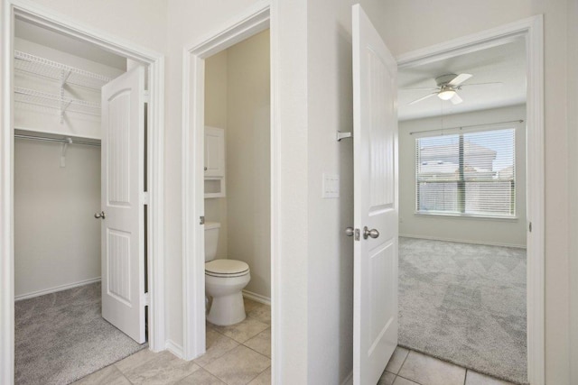 212 Mauldin St, Georgetown, TX 78628 - bathroom featuring ceiling fan, toilet, baseboards, and tile patterned floors