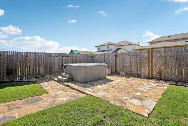 212 Mauldin St, Georgetown, TX 78628 - fenced backyard with a patio and a hot tub