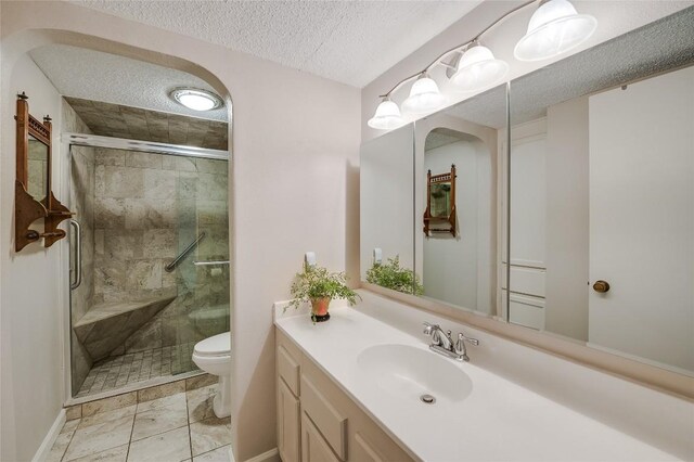 15 Casa Verde Dr, Lakeway, TX 78734 - full bath with toilet, vanity, a stall shower, a textured ceiling, and marble look tile flooring