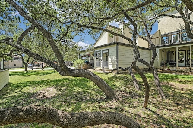 view of property exterior with a yard