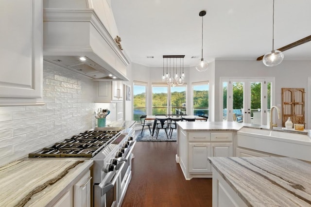 kitchen with premium range hood, decorative backsplash, double oven range, dark wood-style flooring, and crown molding