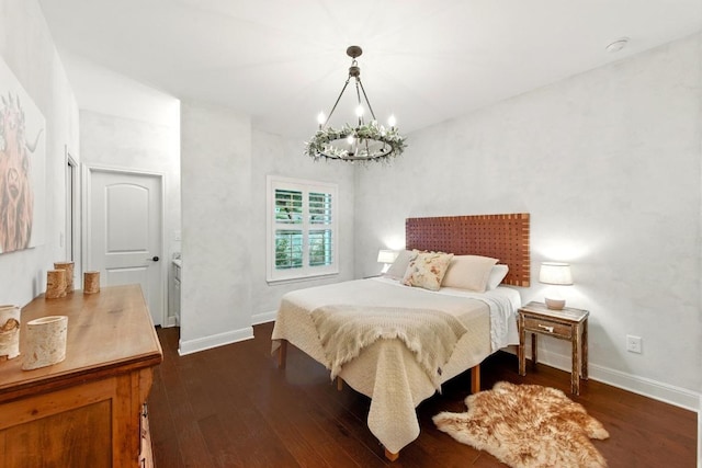 bedroom featuring a chandelier, dark wood finished floors, and baseboards
