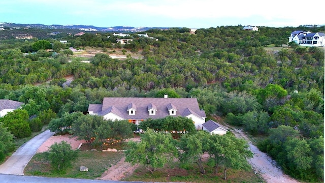aerial overview of property's location featuring a heavily wooded area