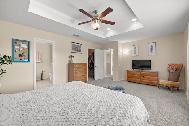 5228 Bantom Woods Bnd, Austin, TX 78724 - bedroom featuring ornamental molding, a raised ceiling, a spacious closet, recessed lighting, and connected bathroom