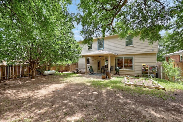 5228 Bantom Woods Bnd, Austin, TX 78724 - back of house featuring a patio, a garden, and a fenced backyard