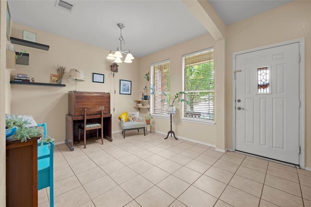 5228 Bantom Woods Bnd, Austin, TX 78724 - entrance foyer with baseboards, a chandelier, and light tile patterned floors