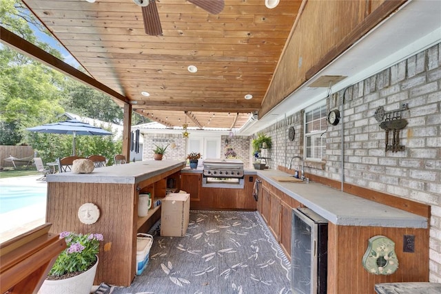 240 2 Mile Ln, Smithville, TX 78957 - view of patio / terrace with wine cooler, area for grilling, and a ceiling fan