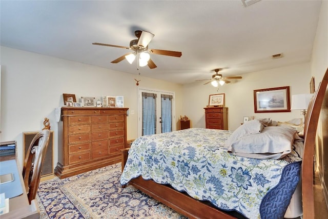 240 2 Mile Ln, Smithville, TX 78957 - bedroom with french doors, access to exterior, and ceiling fan