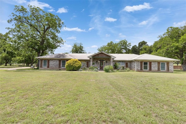 240 2 Mile Ln, Smithville, TX 78957 - ranch-style home with a front lawn and brick siding
