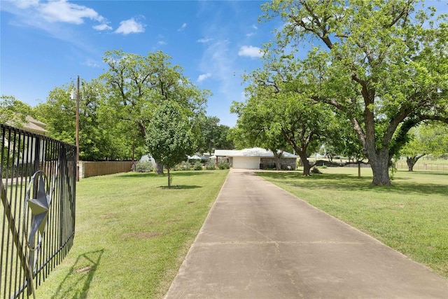 240 2 Mile Ln, Smithville, TX 78957 - view of yard with a garage and driveway
