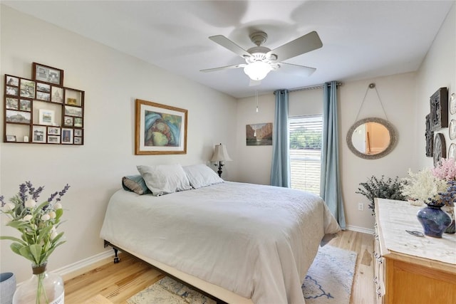 240 2 Mile Ln, Smithville, TX 78957 - bedroom featuring light wood finished floors, baseboards, and ceiling fan