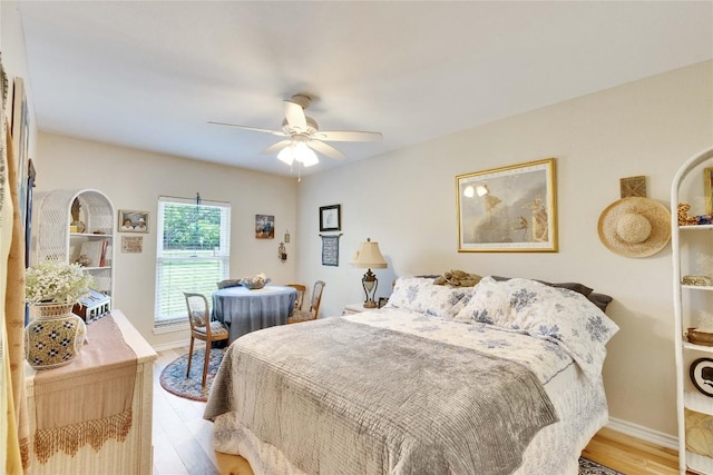 240 2 Mile Ln, Smithville, TX 78957 - bedroom with light wood-style flooring, a ceiling fan, and baseboards
