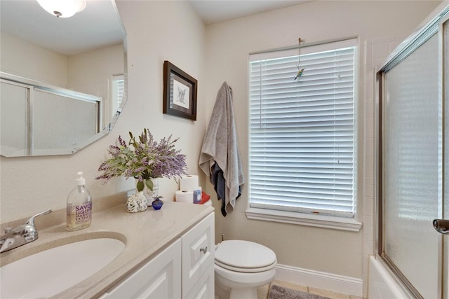 240 2 Mile Ln, Smithville, TX 78957 - bathroom featuring vanity, toilet, plenty of natural light, and bath / shower combo with glass door