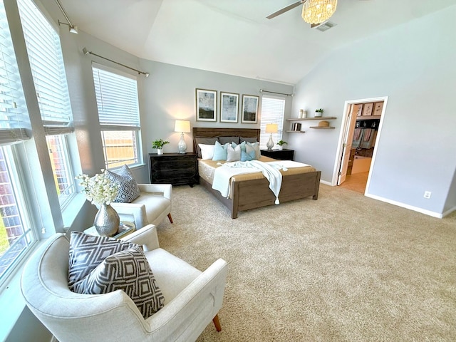 carpeted bedroom with vaulted ceiling, baseboards, ensuite bath, and ceiling fan