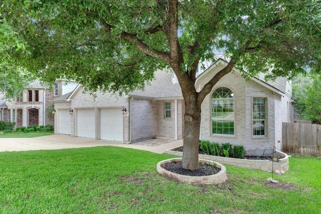 traditional home featuring driveway and a garage