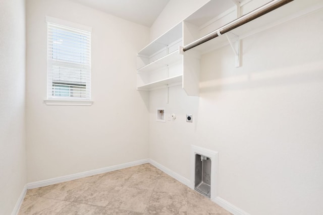 washroom with hookup for a washing machine, electric dryer hookup, and baseboards
