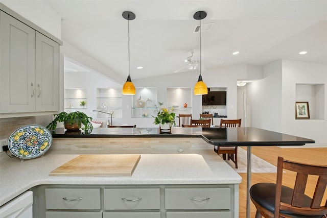 3000 Greenlawn Pkwy, Austin, TX 78757 - kitchen featuring gray cabinets, a peninsula, dishwasher, decorative light fixtures, and a ceiling fan