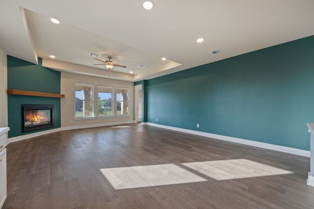 159 Nodena Dr, Dripping Springs, TX 78620 - unfurnished living room with a ceiling fan, a large fireplace, wood finished floors, baseboards, and recessed lighting