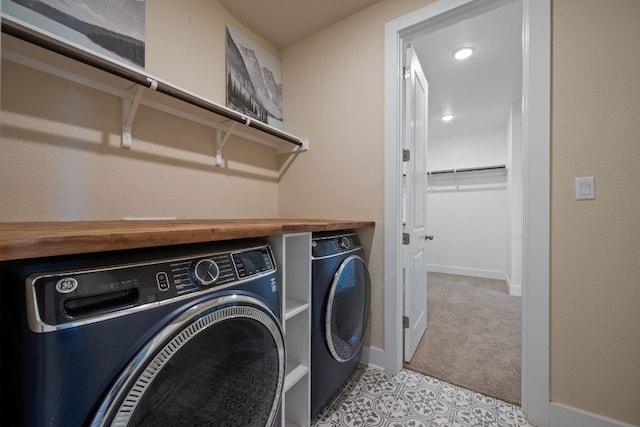 159 Nodena Dr, Dripping Springs, TX 78620 - laundry room featuring washer and dryer, baseboards, and light colored carpet