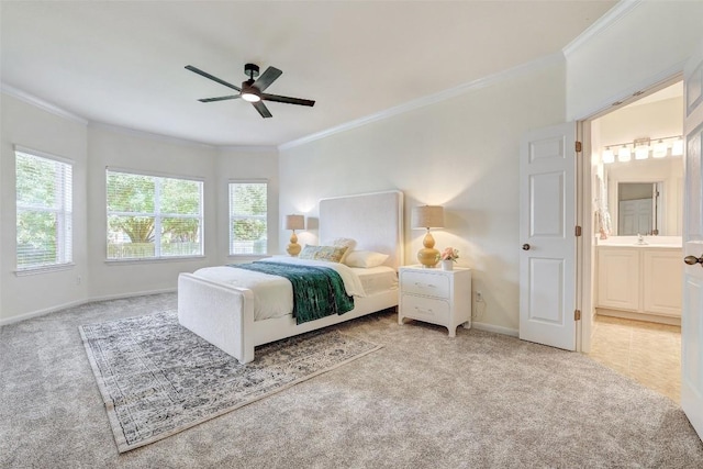 carpeted bedroom with ornamental molding, baseboards, a ceiling fan, and connected bathroom
