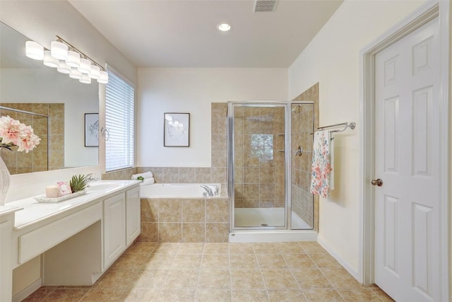 full bathroom featuring a stall shower, a garden tub, vanity, tile patterned floors, and recessed lighting