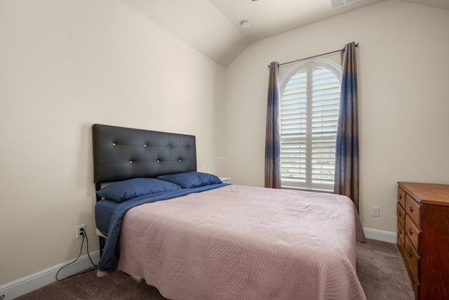 carpeted bedroom featuring baseboards and lofted ceiling