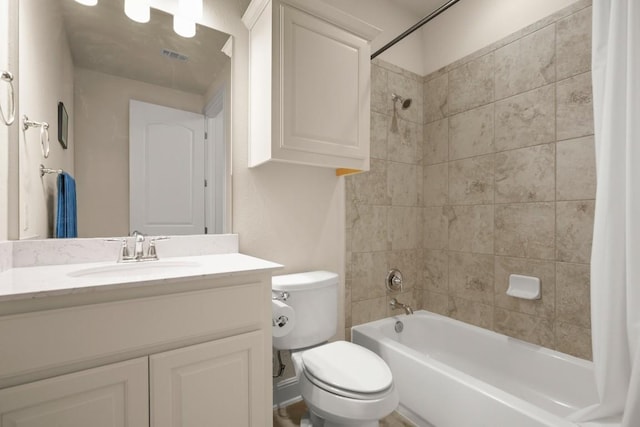 full bath with shower / tub combo with curtain, toilet, and vanity