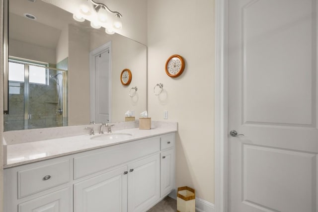 full bathroom featuring an enclosed shower and vanity