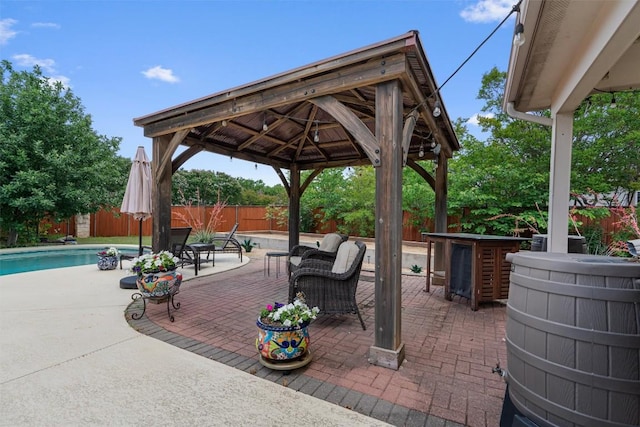 view of patio / terrace with a gazebo, a fenced backyard, and outdoor lounge area