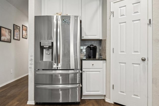 1413 Coffee Tree Dr, New Braunfels, TX 78130 - kitchen with stainless steel fridge, white cabinets, dark wood-type flooring, baseboards, and tasteful backsplash