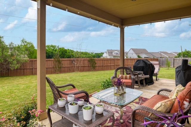 view of patio featuring a grill