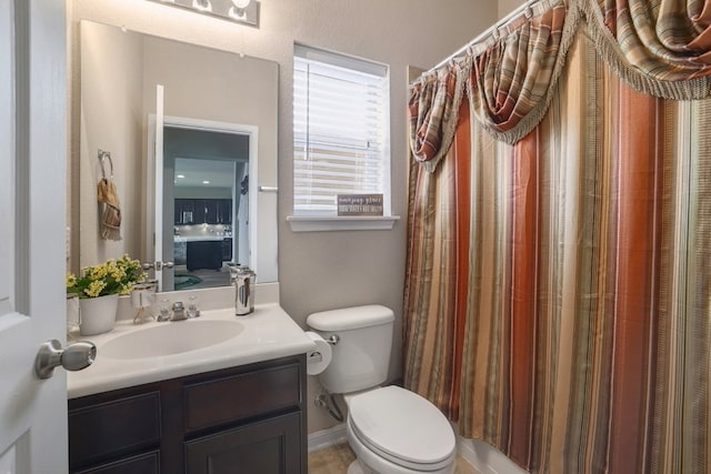 full bath with toilet and vanity