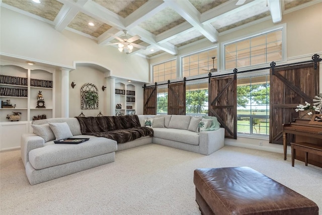 17270 Fm 112, Thrall, TX 76578 - living area with a towering ceiling, carpet, a barn door, a ceiling fan, and coffered ceiling