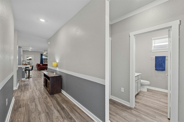 144 Shawii Pass, Leander, TX 78641 - hallway featuring light wood-style floors and baseboards