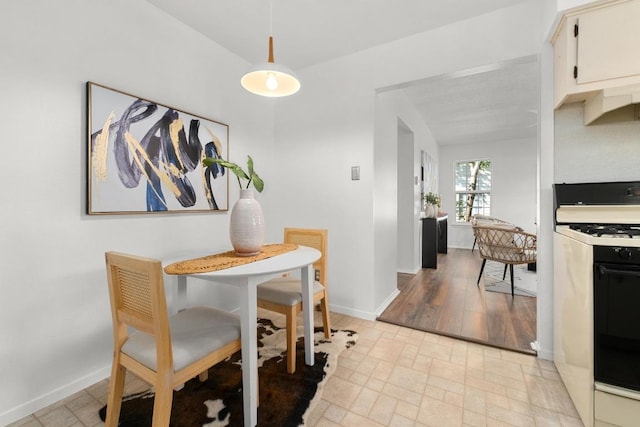 dining room featuring baseboards