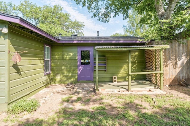 back of property with fence