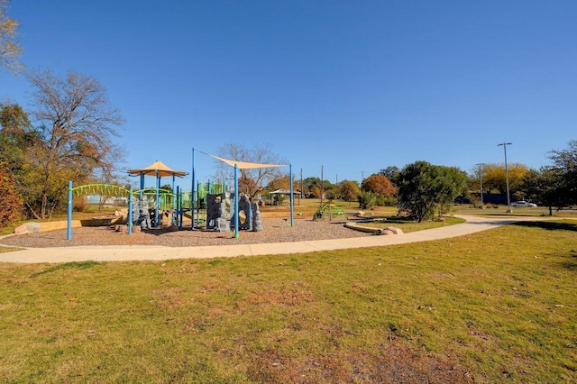 community play area featuring a lawn