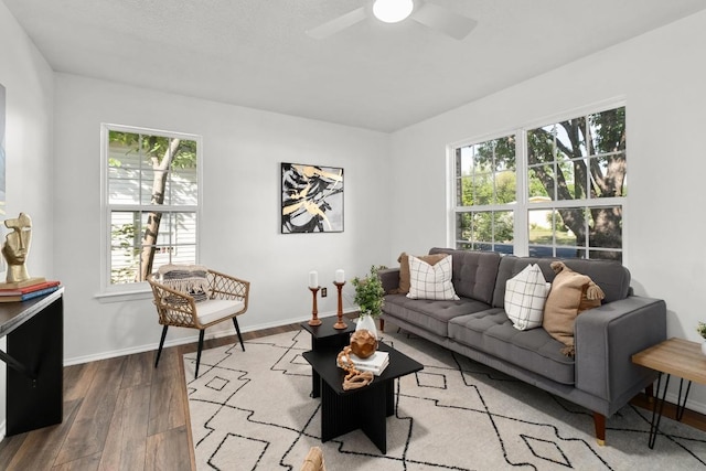 4613 Greenridge Ter, Austin, TX 78745 - living area featuring wood finished floors, plenty of natural light, baseboards, and ceiling fan