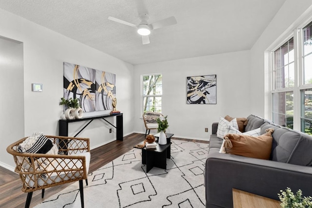 4613 Greenridge Ter, Austin, TX 78745 - living room with light wood-type flooring, a ceiling fan, and baseboards