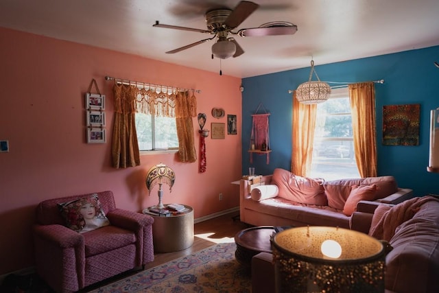 1305 Larkspur Rd, Austin, TX 78758 - living area featuring ceiling fan, wood finished floors, and baseboards