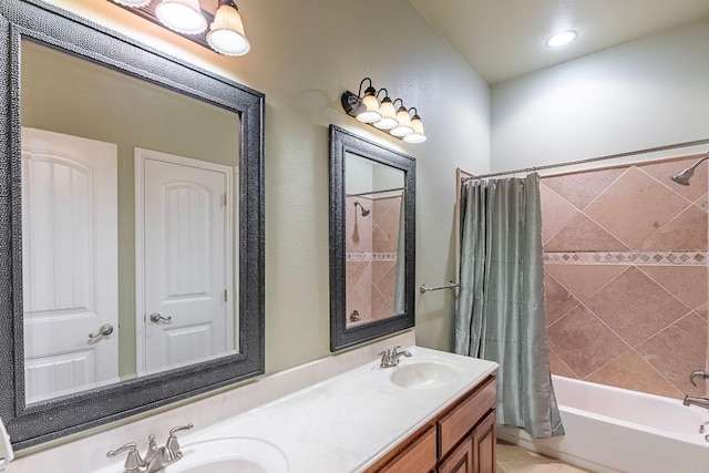 bathroom featuring shower / bath combo, double vanity, and tile patterned flooring