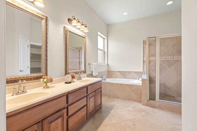 15105 General Williamson Dr, Austin, TX 78734 - bathroom with a bath, double vanity, a shower stall, tile patterned flooring, and a spacious closet
