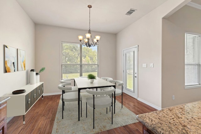 15105 General Williamson Dr, Austin, TX 78734 - dining area featuring a chandelier and dark wood-style flooring