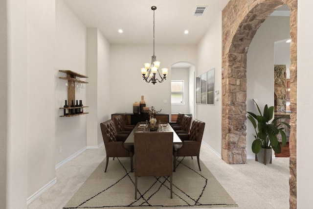 15105 General Williamson Dr, Austin, TX 78734 - carpeted dining space with arched walkways, a chandelier, and recessed lighting