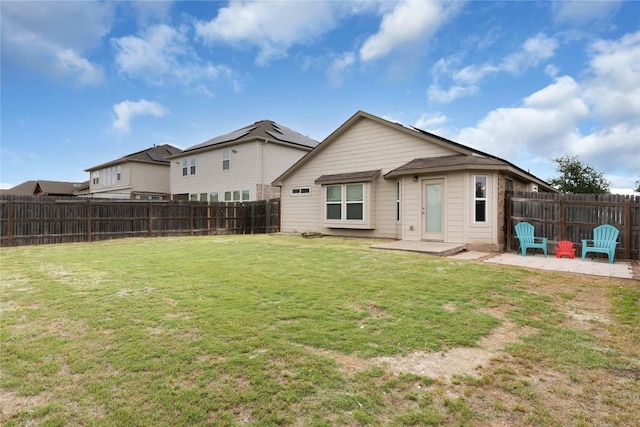 rear view of property featuring a patio area