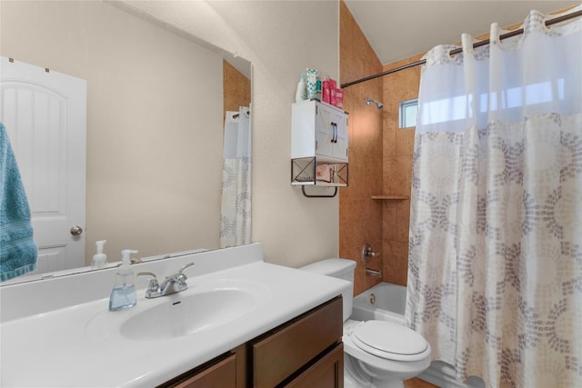 full bath featuring toilet, vanity, and shower / bath combo